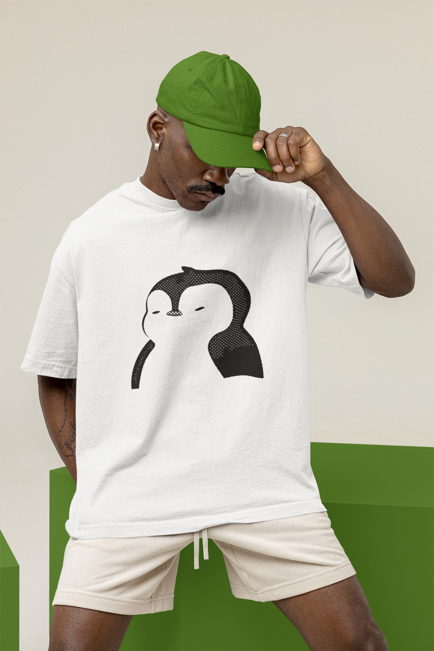 Oversized tee with distinctive Pudgy Penguin motif in white.